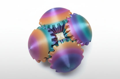 Colorful gear-shaped sensory ball on a wooden surface