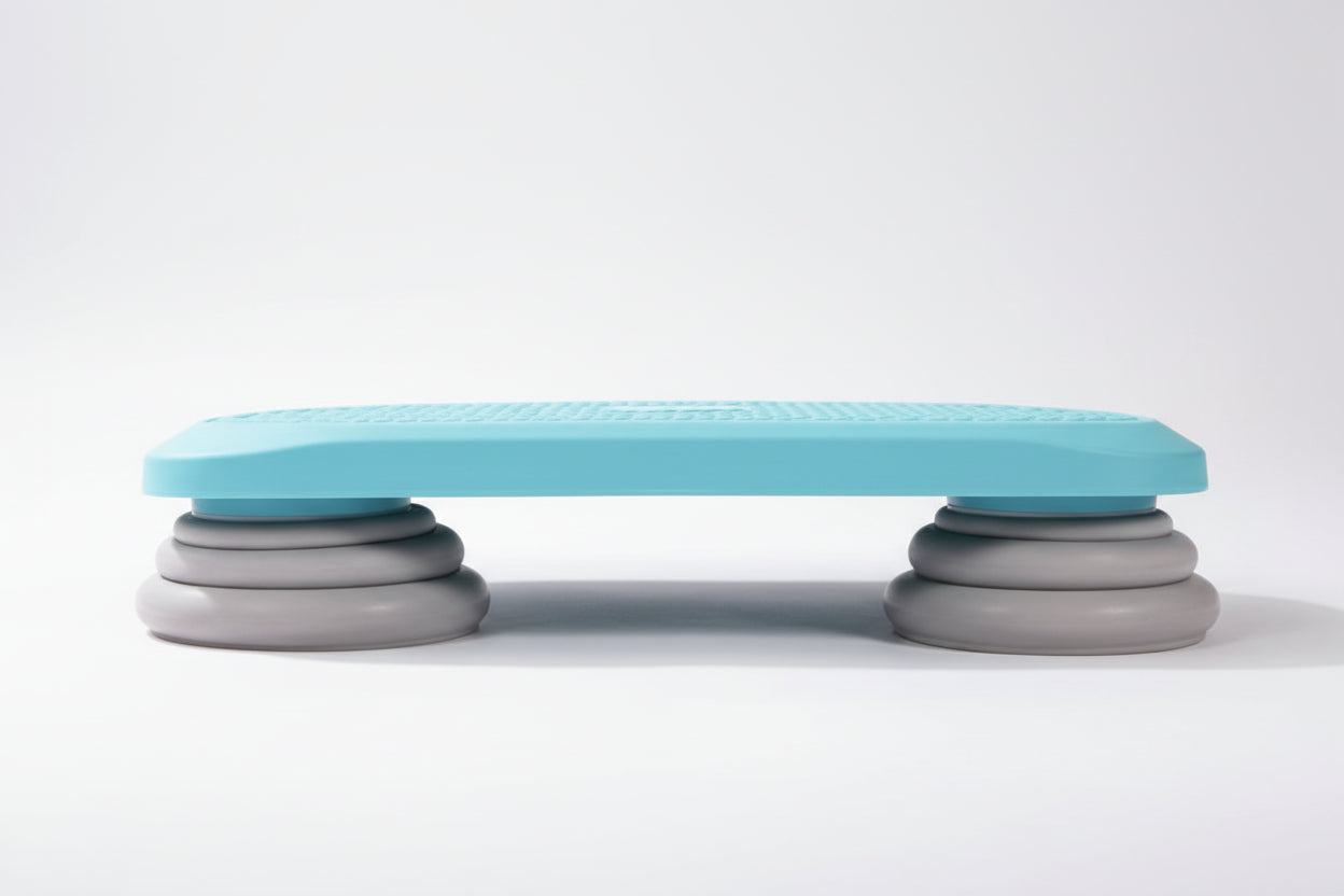Side view of a blue mini kids’ sensory trampoline showing its sturdy grey stacked support legs, designed for stable jumping, balance training, and sensory play.