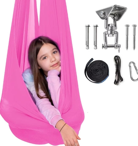 Child relaxing in a pink sensory hammock swing, promoting focus, emotional regulation and calm