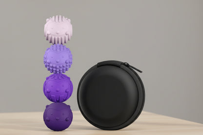 Set of purple textured fidget balls with a black carrying case on a white background