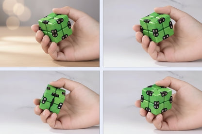 Green fidget cube being manipulated by hands on a white background