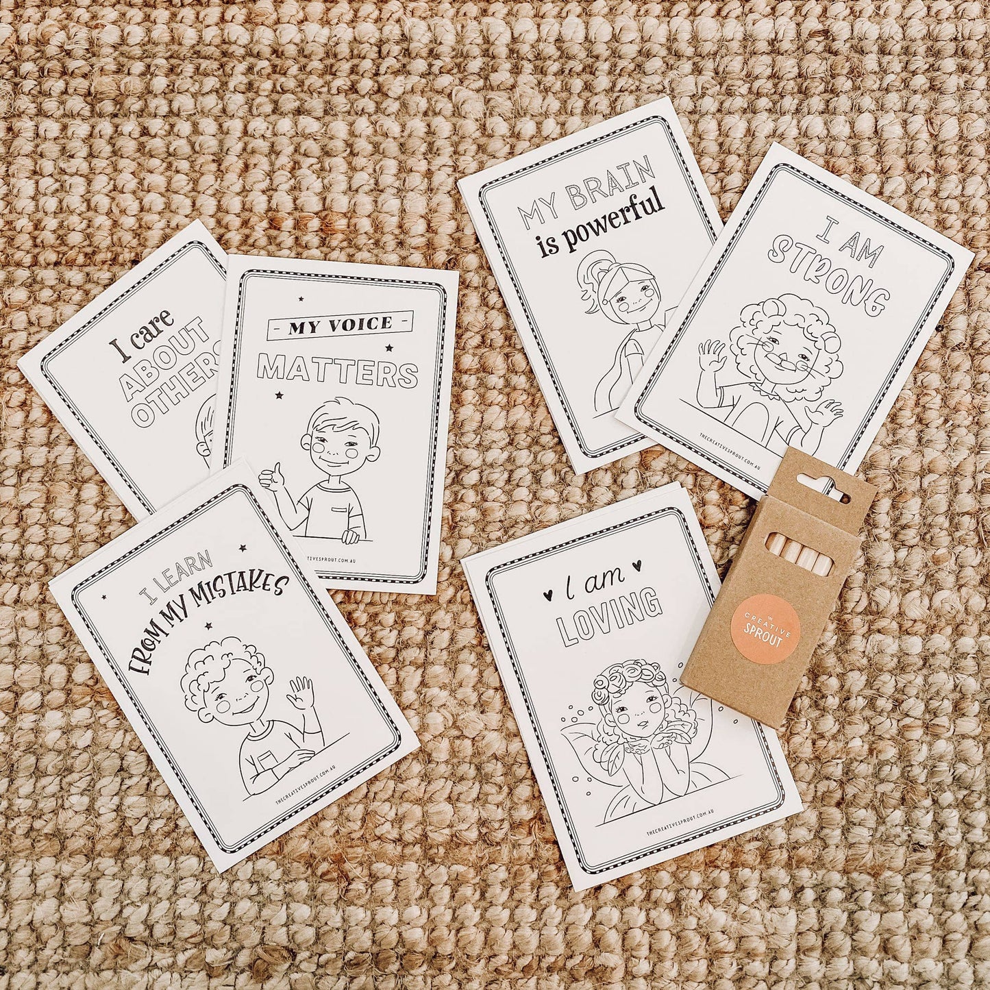 Set of affirmation cards with illustrations and text on a textured surface