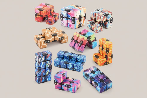 Collection of colorful fidget cubes in various patterns on a white background