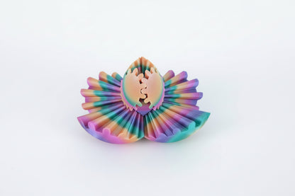 Colorful fidget ball with a unicorn design on a wooden surface