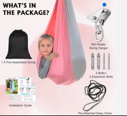 Package contents of a swing set with swing, hanger, bolts, and installation guide on a pink background.