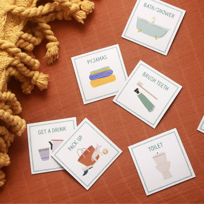 Educational cards on a wooden surface with illustrations and text.