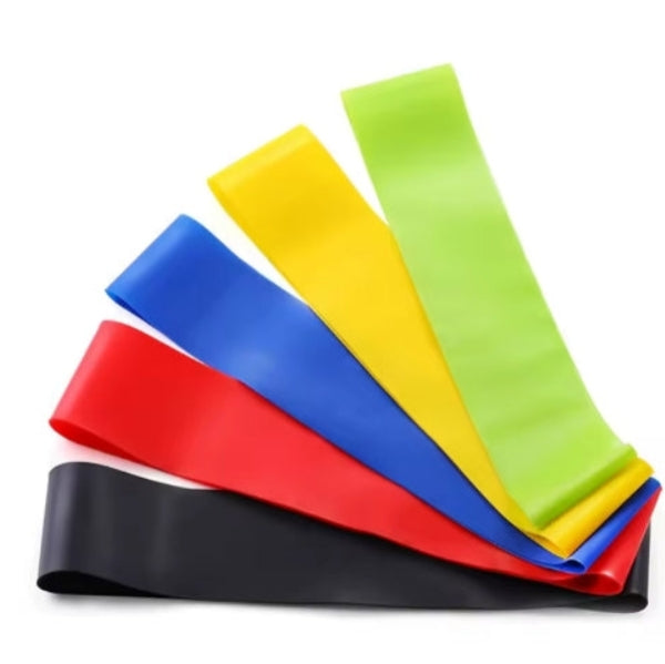 Set of colorful resistance bands on a white background